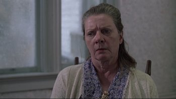 Movie still from “Wise Blood” (1979), directed by John Huston – An older woman is looking at the camera; Close Up shot, Low angle