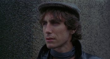 Movie still from “Withnail & I” (1987), directed by Bruce Robinson – A person wearing a hat; Close Up shot, Low angle