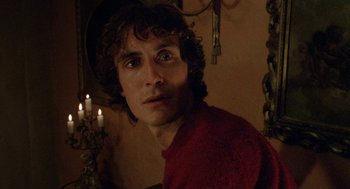 Movie still from “Withnail & I” (1987), directed by Bruce Robinson – A person wearing a red shirt; Close Up shot, Over the shoulder angle