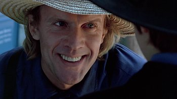 Movie still from “Witness” (1985), directed by Peter Weir – A person wearing a straw hat; Close Up shot, Over the shoulder angle