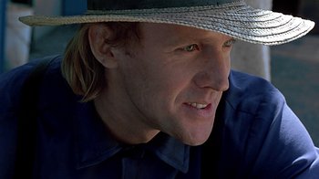 Movie still from “Witness” (1985), directed by Peter Weir – A person wearing a hat; Close Up shot, Low angle