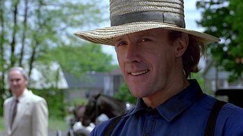 Movie still from “Witness” (1985), directed by Peter Weir – A person wearing a hat; Close Up shot, Low angle
