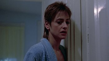 Movie still from “Witness” (1985), directed by Peter Weir – A person in a room near a window; Close Up shot, Low angle