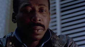 Movie still from “Witness” (1985), directed by Peter Weir – A person wearing a jacket; Close Up shot, Low angle