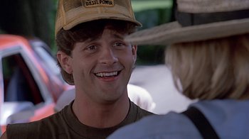 Movie still from “Witness” (1985), directed by Peter Weir – A person wearing a hat; Close Up shot, Over the shoulder angle