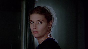 Movie still from “Witness” (1985), directed by Peter Weir – A person wearing a hat; Close Up shot, Low angle