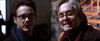 Movie still from “Wonder Boys” (2000), directed by Curtis Hanson – Two men with glasses are posing for a picture; Close Up shot, Low angle