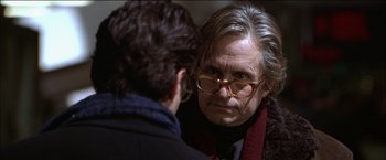 Movie still from “Wonder Boys” (2000), directed by Curtis Hanson – An older woman wearing glasses looking at a younger man; Close Up shot, Over the shoulder angle