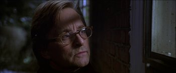 Movie still from “Wonder Boys” (2000), directed by Curtis Hanson – An older man wearing glasses looking at the camera; Close Up shot, Low angle