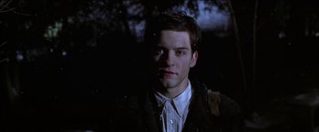 Movie still from “Wonder Boys” (2000), directed by Curtis Hanson – A young man in a jacket is looking at the camera; Close Up shot, Low angle