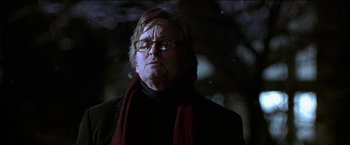 Movie still from “Wonder Boys” (2000), directed by Curtis Hanson – A man wearing glasses and a red scarf; Close Up shot, Low angle