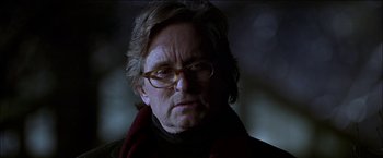 Movie still from “Wonder Boys” (2000), directed by Curtis Hanson – An older man wearing glasses and wearing a scarf; Close Up shot, Low angle