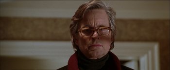 Movie still from “Wonder Boys” (2000), directed by Curtis Hanson – An older man wearing glasses and a red scarf; Close Up shot, Low angle