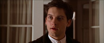 Movie still from “Wonder Boys” (2000), directed by Curtis Hanson – A person wearing a suit and tie; Close Up shot, High angle