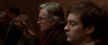 Movie still from “Wonder Boys” (2000), directed by Curtis Hanson – Two men and a woman sitting next to each other; Close Up shot, Over the shoulder angle