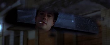 Movie still from “Wonder Boys” (2000), directed by Curtis Hanson – A man sitting in a car with a cigarette in his mouth; Close Up shot, Low angle
