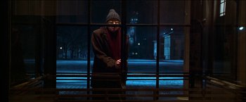 Movie still from “Wonder Boys” (2000), directed by Curtis Hanson – A man standing in front of a window at night; Wide shot, Over the shoulder angle