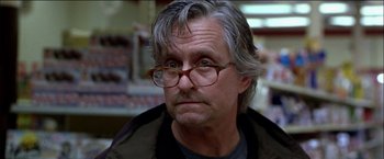 Movie still from “Wonder Boys” (2000), directed by Curtis Hanson – An older man wearing glasses and a brown jacket; Close Up shot, Low angle
