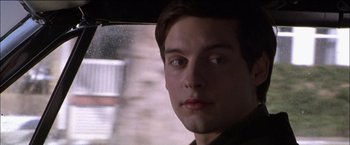 Movie still from “Wonder Boys” (2000), directed by Curtis Hanson – A young man looking out the window of a car; Close Up shot, Over the shoulder angle