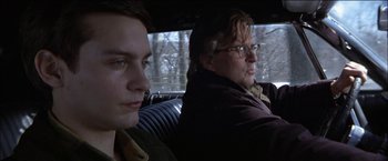 Movie still from “Wonder Boys” (2000), directed by Curtis Hanson – Two men sitting in the back seat of a car; Close Up shot, Low angle