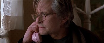 Movie still from “Wonder Boys” (2000), directed by Curtis Hanson – An older man holding a pink phone up to his ear; Close Up shot, Low angle