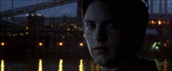 Movie still from “Wonder Boys” (2000), directed by Curtis Hanson – A young man is looking out of a window at night; Close Up shot, Low angle