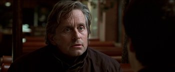 Movie still from “Wonder Boys” (2000), directed by Curtis Hanson – An older man with grey hair looking at the camera; Close Up shot, Over the shoulder angle