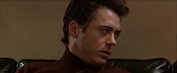 Movie still from “Wonder Boys” (2000), directed by Curtis Hanson – A person wearing a brown sweater; Close Up shot, Over the shoulder angle