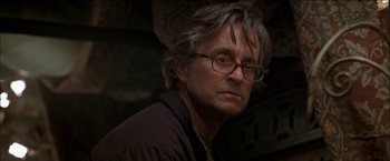 Movie still from “Wonder Boys” (2000), directed by Curtis Hanson – A person wearing glasses and a brown jacket; Close Up shot, Low angle