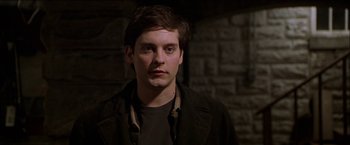 Movie still from “Wonder Boys” (2000), directed by Curtis Hanson – A young man in a black jacket is looking at the camera; Close Up shot, Low angle