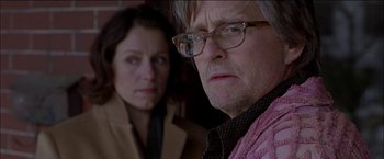 Movie still from “Wonder Boys” (2000), directed by Curtis Hanson – A man and a woman are looking at the camera; Close Up shot, Over the shoulder angle