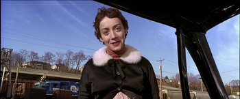 Movie still from “Wonder Boys” (2000), directed by Curtis Hanson – An older woman wearing a black coat and a white fur collar; Close Up shot, Low angle