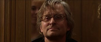 Movie still from “Wonder Boys” (2000), directed by Curtis Hanson – A person wearing glasses; Close Up shot, Over the shoulder angle