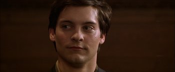 Movie still from “Wonder Boys” (2000), directed by Curtis Hanson – A man's face in a dark room; Close Up shot, High angle