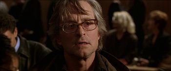 Movie still from “Wonder Boys” (2000), directed by Curtis Hanson – A person wearing glasses; Close Up shot, Over the shoulder angle