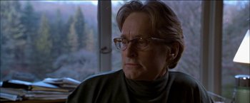 Movie still from “Wonder Boys” (2000), directed by Curtis Hanson – An older woman wearing glasses looking out of a window; Close Up shot, Over the shoulder angle
