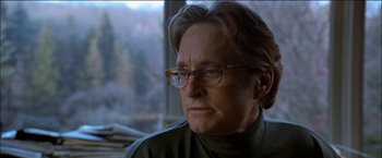 Movie still from “Wonder Boys” (2000), directed by Curtis Hanson – An older woman wearing glasses and a green shirt; Close Up shot, Over the shoulder angle