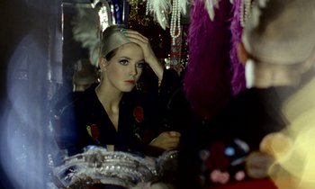 Movie still from “Wonderwall” (1968), directed by Joe Massot – A woman sitting in front of a mirror looking at herself in the mirror; Close Up shot, Over the shoulder angle