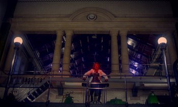 Movie still from “Wonderwall” (1968), directed by Joe Massot – A person standing on top of a railing in front of a building; Extreme Wide shot, Low angle