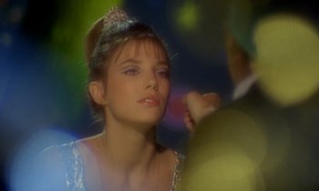 Movie still from “Wonderwall” (1968), directed by Joe Massot – A woman with a tiara on her head; Close Up shot, Over the shoulder angle