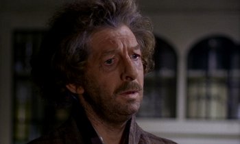 Movie still from “Wonderwall” (1968), directed by Joe Massot – A person wearing a brown shirt; Close Up shot, Low angle