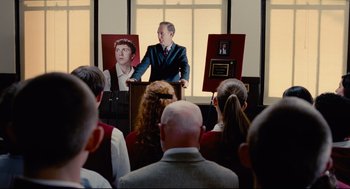 A man standing at a podium in front of a group of people