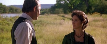 Movie still from “Wyatt Earp” (1994), directed by Lawrence Kasdan – A man and a woman are talking in a field; Close Up shot, Over the shoulder angle