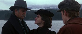 Movie still from “Wyatt Earp” (1994), directed by Lawrence Kasdan – A man and a woman in a hat and dress; Close Up shot, Low angle