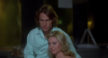 Movie still from “Xanadu” (1980), directed by Robert Greenwald – A man and a woman sitting next to each other; Close Up shot, Low angle