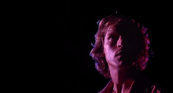 Movie still from “Xanadu” (1980), directed by Robert Greenwald – A person with long hair; Close Up shot, Low angle