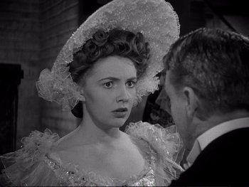 Movie still from “Yankee Doodle Dandy” (1942), directed by Michael Curtiz – A man and a woman in a victorian era dress; Close Up shot, Over the shoulder angle