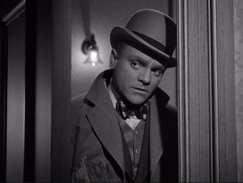 Movie still from “Yankee Doodle Dandy” (1942), directed by Michael Curtiz – A man wearing a hat and a jacket; Close Up shot, Low angle