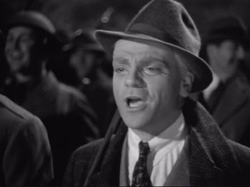 Movie still from “Yankee Doodle Dandy” (1942), directed by Michael Curtiz – An old photo of a man wearing a hat; Close Up shot, Low angle