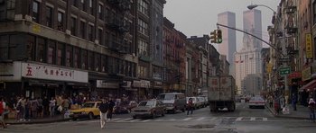 Movie still from “Year of the Dragon” (1985), directed by Michael Cimino – A busy city street filled with lots of traffic; Extreme Wide shot, High angle